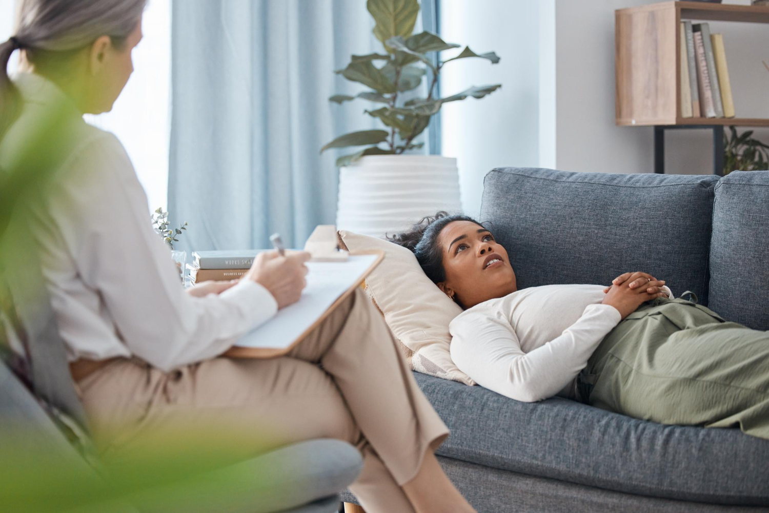 Women laying down on couch talking to a therapist in Lisle IL